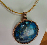 Beautiful Blue stone wrapped into a simple pendant