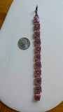 Pink Kaleidescope Cane with Swarovski crystal accents on a silver bracelet