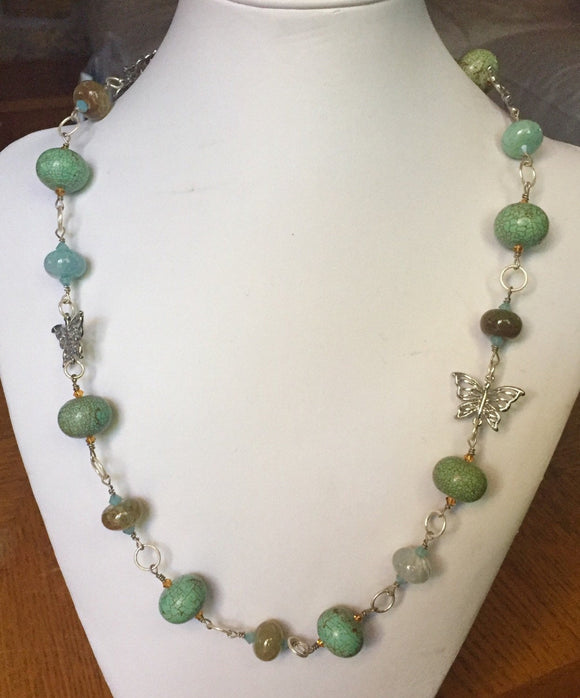 Lovely blends of agate crackle finish turquoise necklace.  Silver tone & Swarovski accents 23